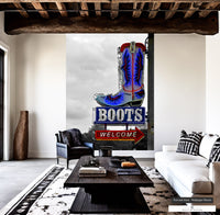Dynamic entryway decor with 'Boots Welcome' neon sign and cowboy boot.