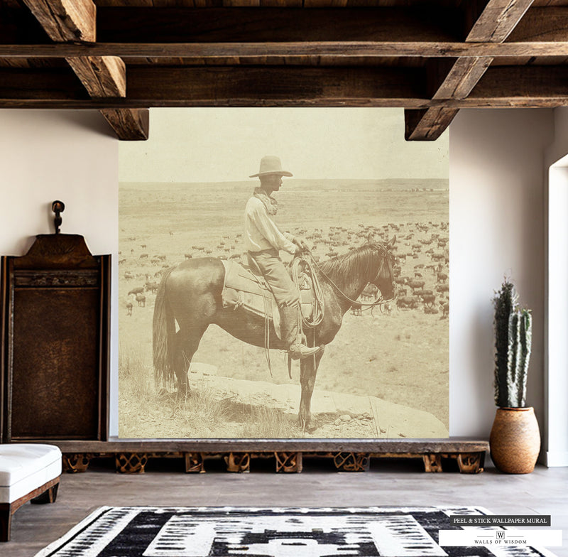 Sepia-toned vintage cowboy rancher on horse landscape mural.