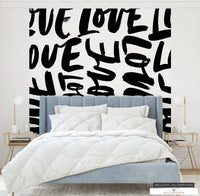 Maximalist home decor featuring bold 'Love' typography wallpaper for an artistic touch.