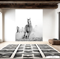 Dynamic photo print of wild horses in motion for Western-themed interiors.