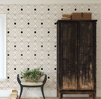 Black geometric peel and stick wallpaper with rustic western flair on cream background.