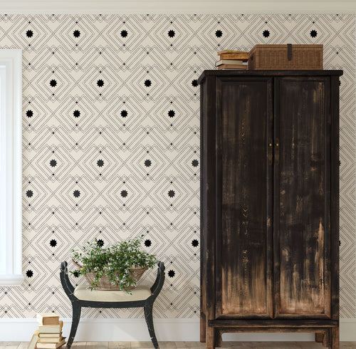 Black geometric peel and stick wallpaper with rustic western flair on cream background.