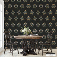 Wildflower Harvest Black peel and stick wallpaper with muted greens, yellows, and oranges on a black linen background.