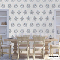 Country living wallpaper with soft blue florals on a cream backdrop.