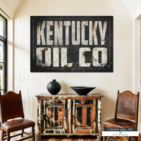 Western cowboy-style Kentucky Oil Co. wall art with faded lettering and vintage charm.