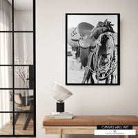 Rustic cowboy saddle canvas artwork for ranch and farmhouse decor.