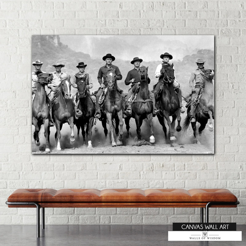 High-contrast black-and-white cowboy canvas print featuring riders on horseback.