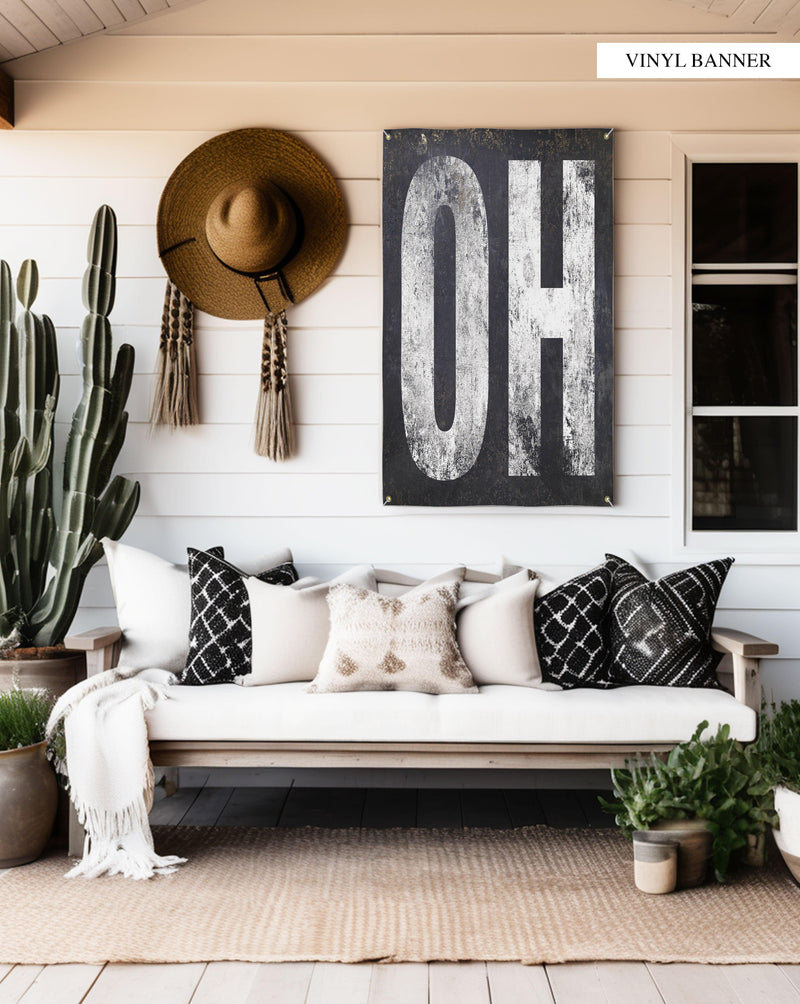 Celebrate Ohio with this weatherproof 'OH' vinyl banner, designed for easy installation. Its elegant white lettering stands out against a stark, weathered background, perfect for expressing state pride anywhere.