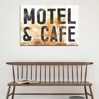 Vintage Western motel sign canvas print with weathered lettering and a rustic distressed finish.