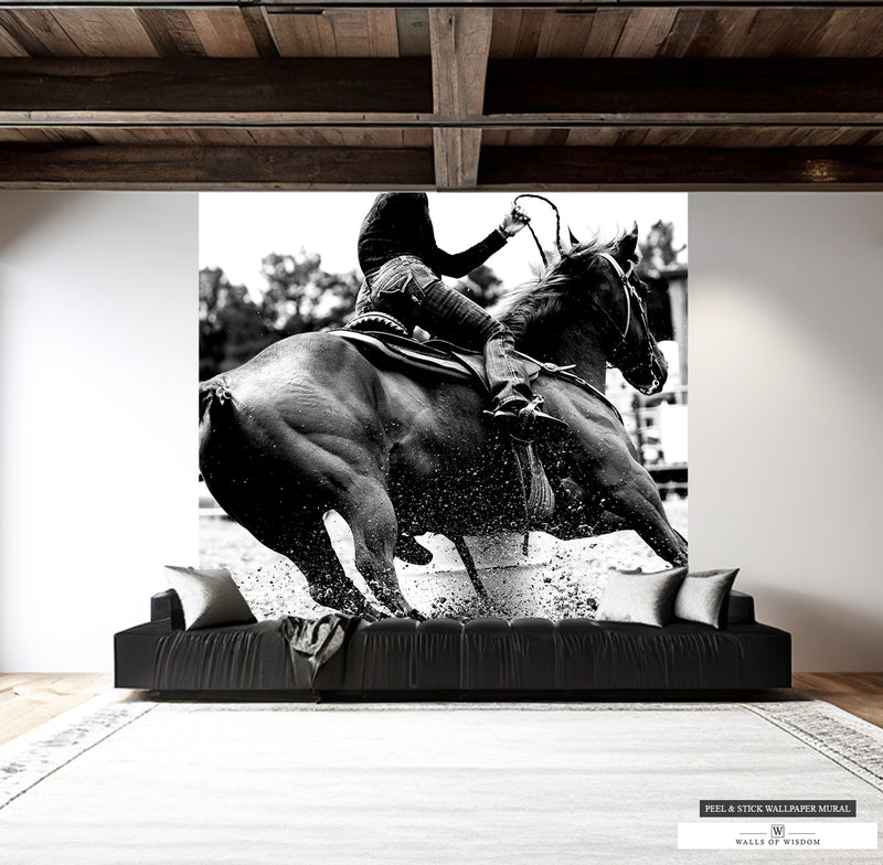 Black and white mural of a woman barrel racer at rodeo in dynamic action.