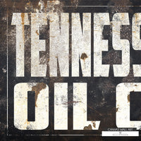 Vintage-inspired Tennessee Oil Co. wall art blending cowboy aesthetics with industrial charm.