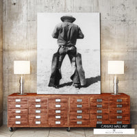 Vintage cowboy in chaps canvas print in black and white.
