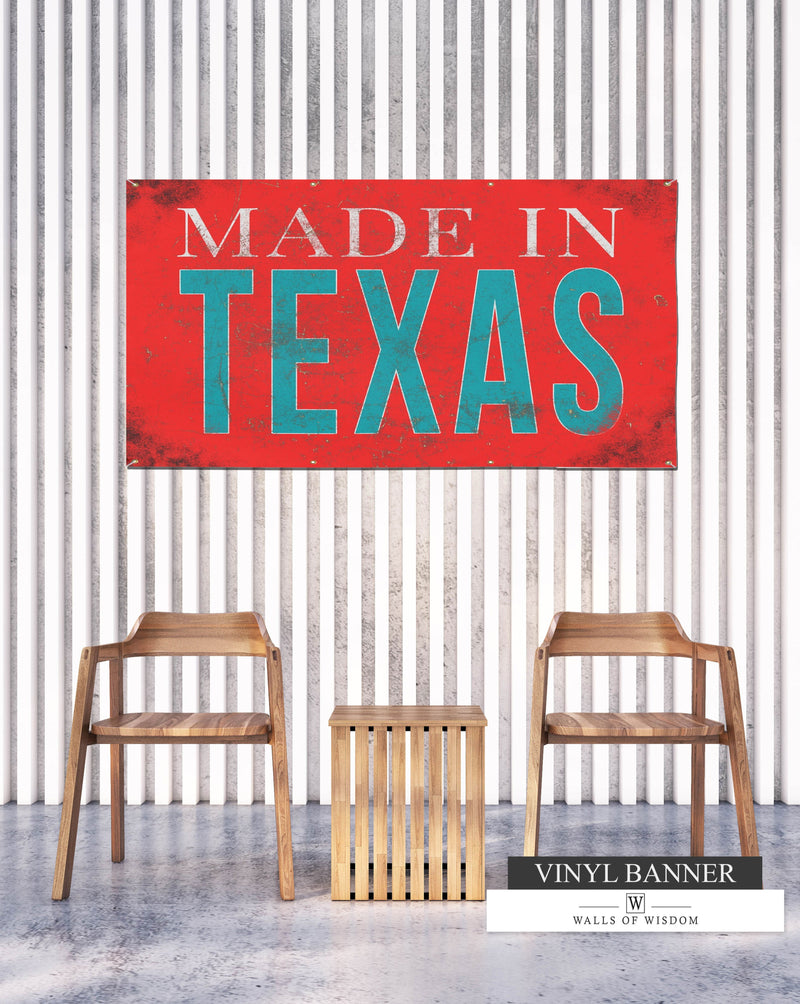 Made In Texas backyard vinyl banner with weathered reddish coral background and distressed teal and off-white font, perfect for adding Texan charm to outdoor spaces.