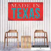 Made In Texas backyard vinyl banner with weathered reddish coral background and distressed teal and off-white font, perfect for adding Texan charm to outdoor spaces.