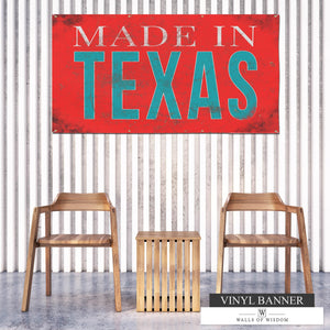 Made In Texas backyard vinyl banner with weathered reddish coral background and distressed teal and off-white font, perfect for adding Texan charm to outdoor spaces.