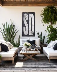 Minimalist 'SD' garden sign in vinyl, offering stylish party decor and yard art with a nod to South Dakota's western heritage.