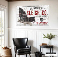 Rustic Christmas sleigh rides sign with chippy paint finish.